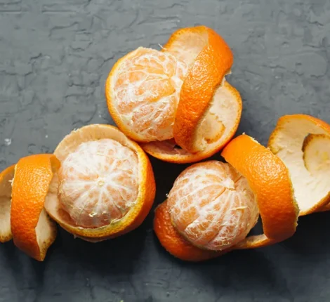 Half peeled oranges