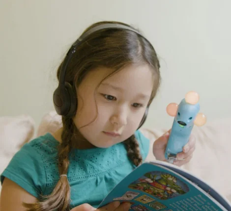 Little girl reading a book 